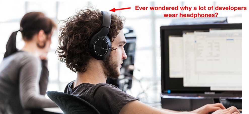 Developer workplace wearing headphone